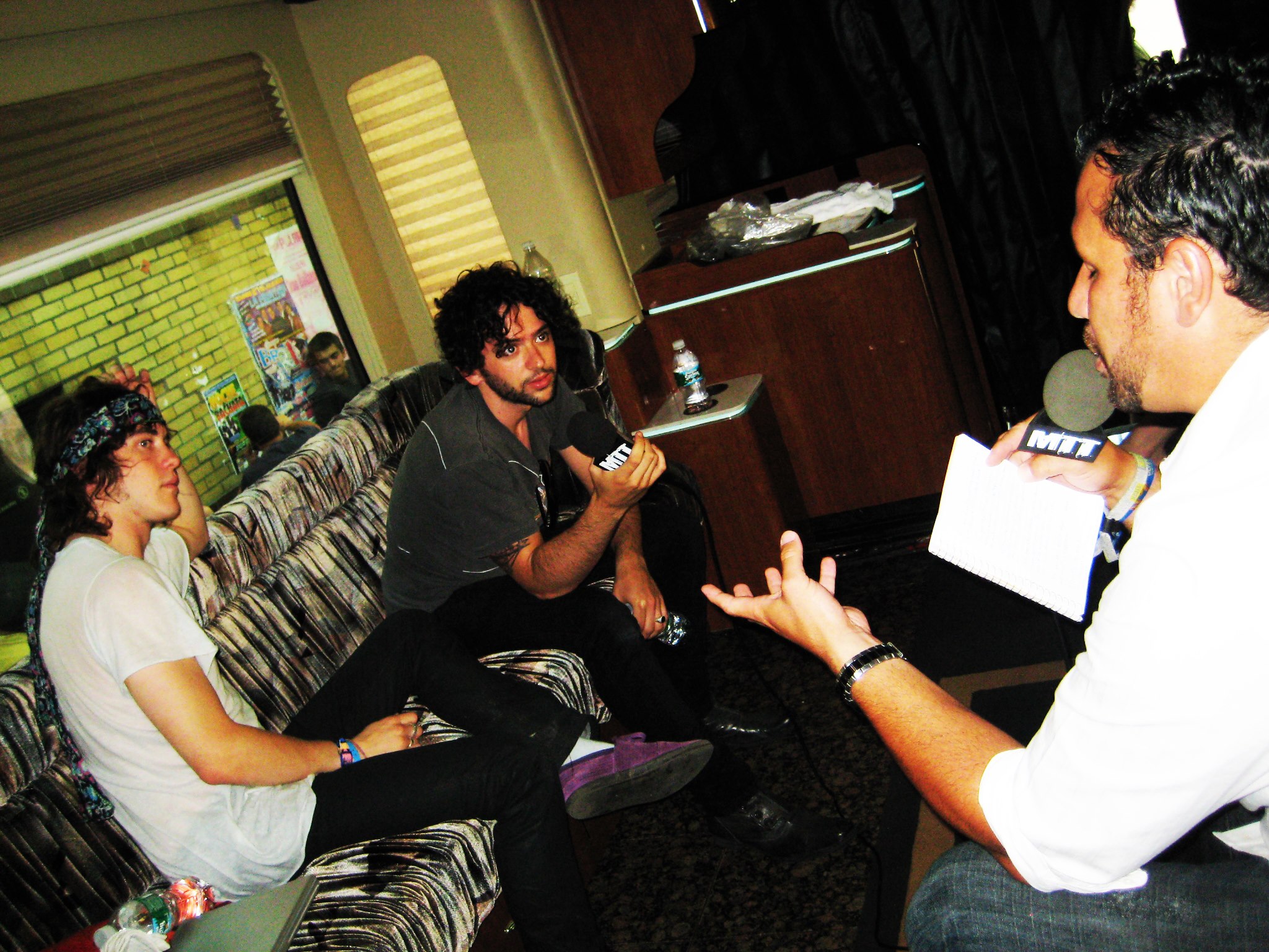 Moe Train interviewing Andrew VanWyngarden and Ben Goldwasser of MGMT inside their tour bus
