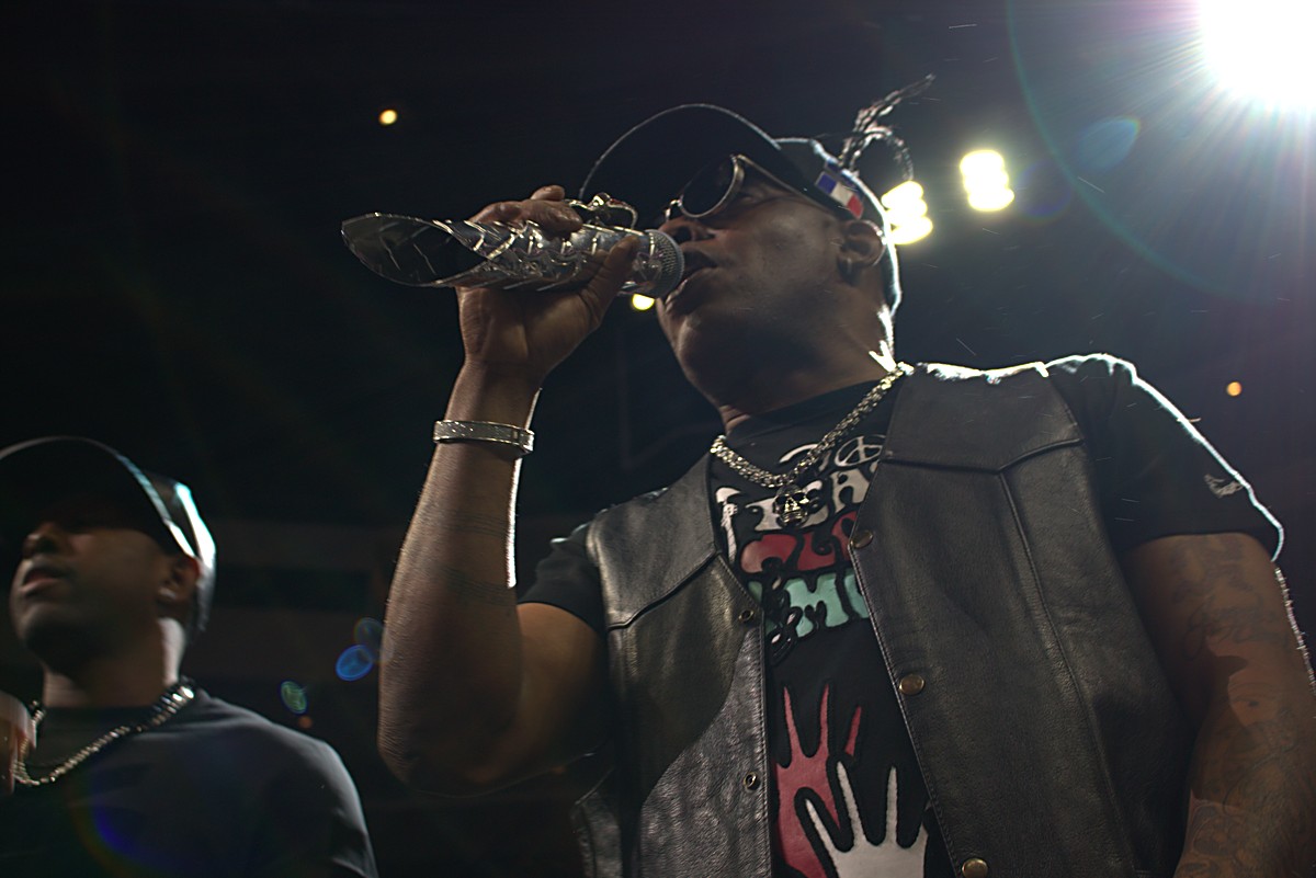 Coolio performing on stage under bright spotlights at Wing Bowl 25